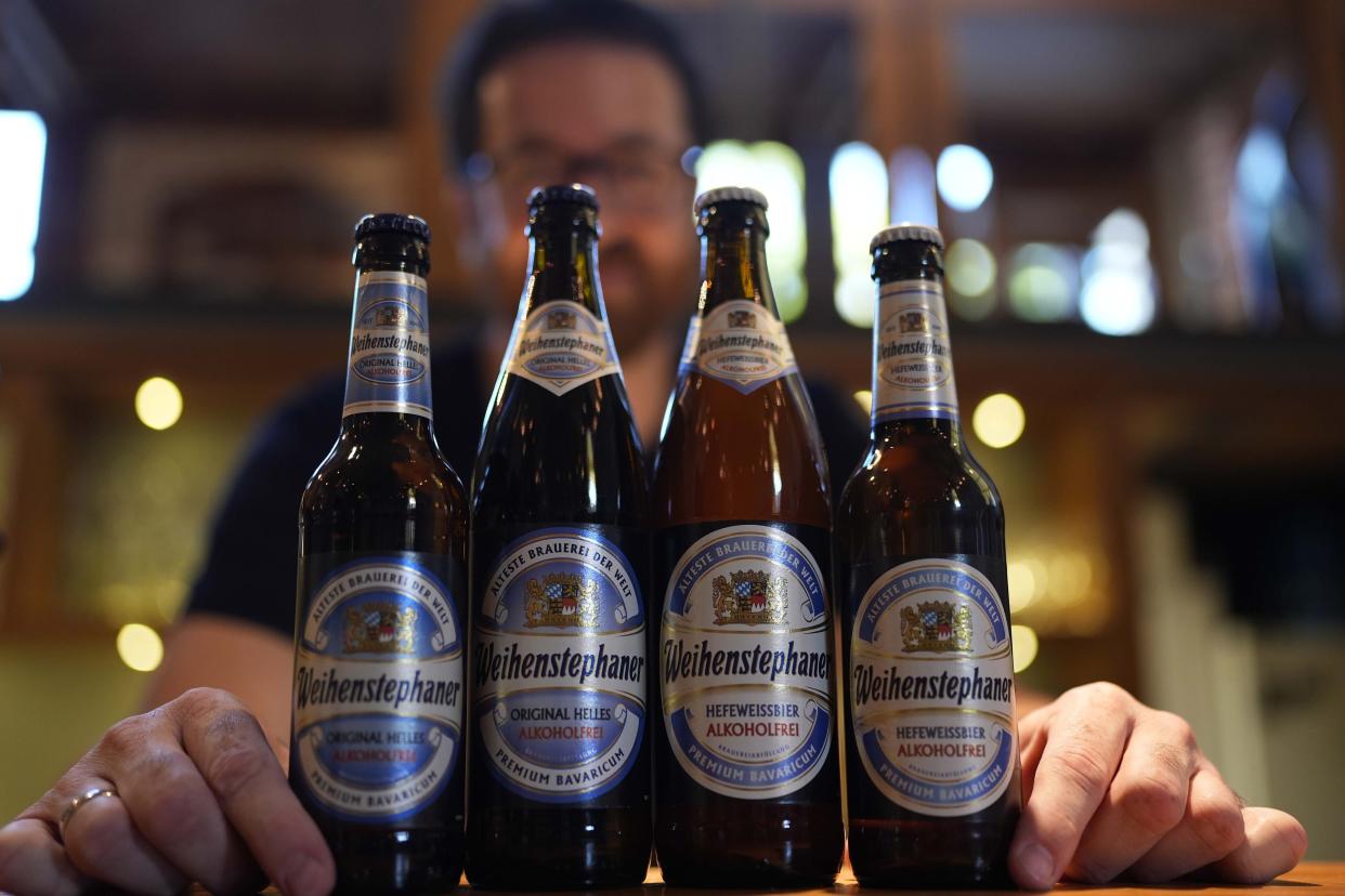 Head Brewmaster Tobias Zollo poses behind non alcoholic beer at the Weihenstephan brewery in Freising, Germany, Friday, Sept. 20, 2024. (AP Photo/Matthias Schrader)