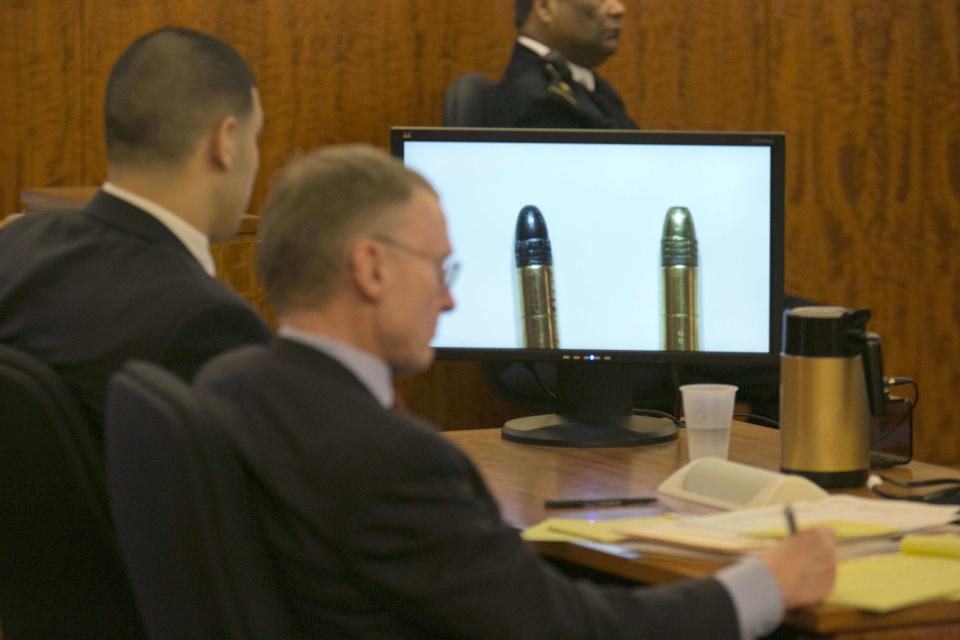 A bullet recovered from a .22 caliber gun on Landry Avenue (L) is compared against one recovered from the home of Aaron Hernandez (R) on the monitor during the murder trial of former NFL player Aaron Hernandez at the Bristol County Superior Court in Fall River, Massachusetts, February 23, 2015. Hernandez is charged with the 2013 murder of Odin Lloyd, 27, a semiprofessional football player who had been dating the sister of Hernandez's fiancee. REUTERS/Dominick Reuter/Pool (UNITED STATES)