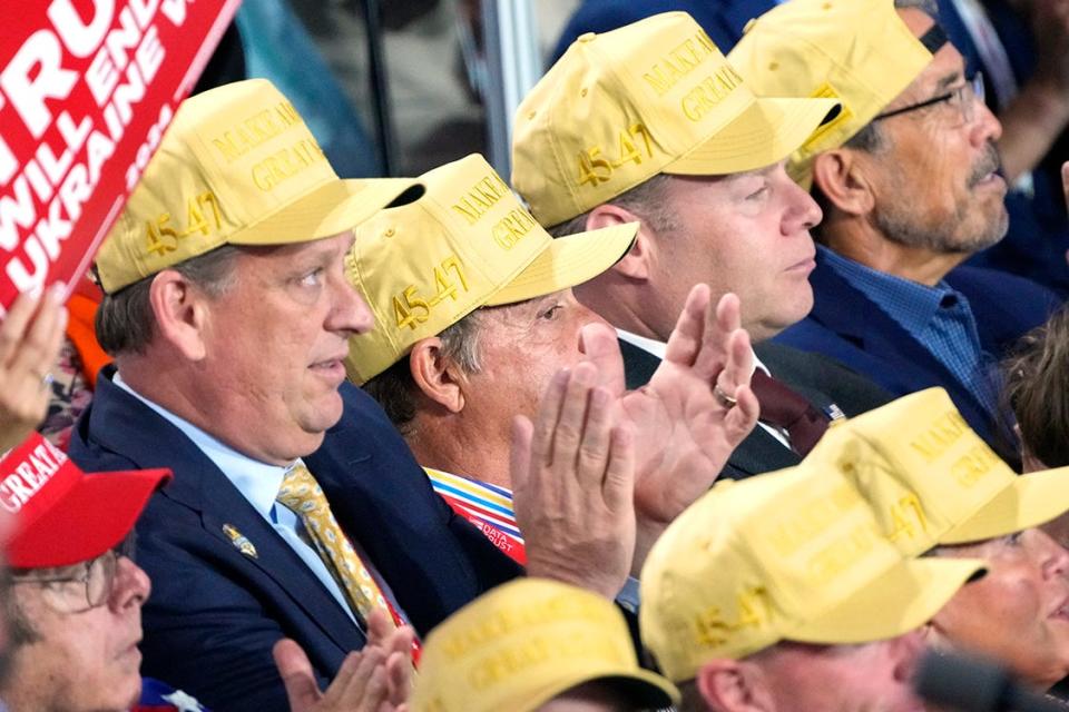 Delegates wear yellow hats during the third day of the Republican National Convention at Fiserv Forum. The third day of the RNC focused on foreign policy and threats.