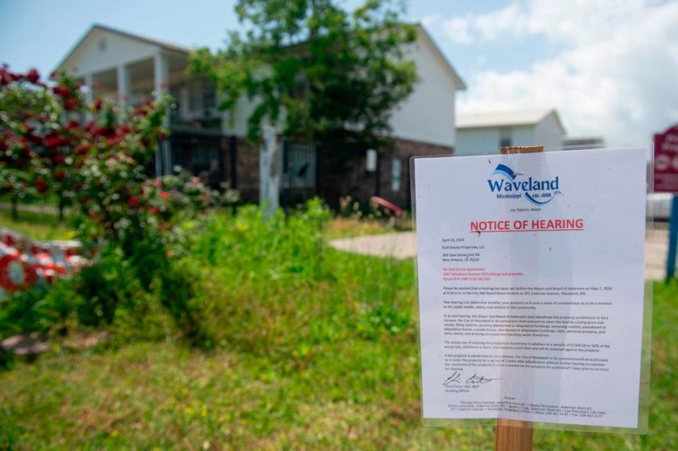 A sign notifying of a hearing stands on the property of the Gulf Grove Apartments in Waveland on Friday, April 19, 2024. The city of Waveland condemned the property over missing roofs, mold, termites and rats and will hold a hearing to determine if the property is a “menace”, which if determined to be so, the city can clean up the property. Hannah Ruhoff/Sun Herald