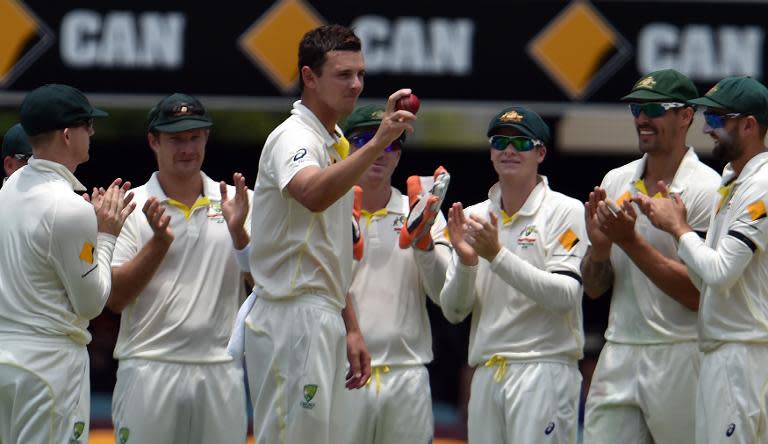 Australian paceman Josh Hazlewood celebrates his five wickets in an innings against India on the second day of their 2nd Test match, at The Gabba in Brisbane, on December 18, 2014