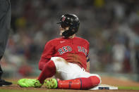 Boston Red Sox's Enrique Hernandez smiles on first base after hitting a two-run single against the Cincinnati Reds during the eighth inning of a baseball game Thursday, June 1, 2023, in Boston. (AP Photo/Steven Senne)