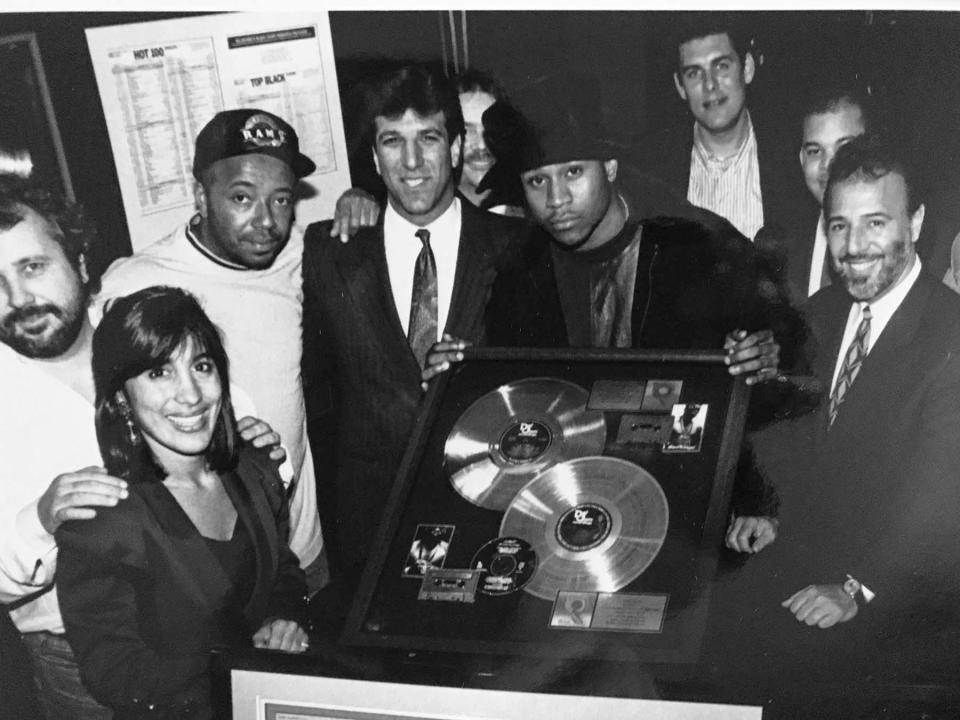 Angela Thomas, then the senior director of product marketing at Columbia Records, celebrates with LL Cool J and others over his multi-platinum success of Mama Said Knock You Out at Def Jam/Columbia Records in 1991.