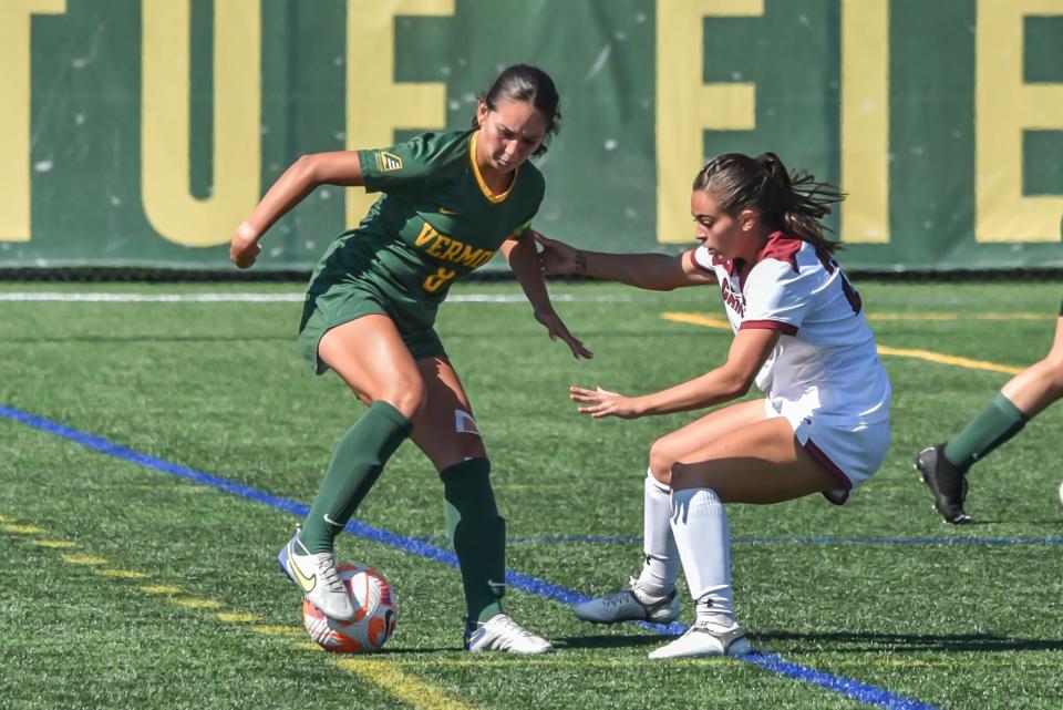 UVM's Alyssa Oviedo works to get by the University of South Carolina's Taylor Jacobson during the Catamounts' game vs the Gamecocks at Virtue Field during the 2022 season.