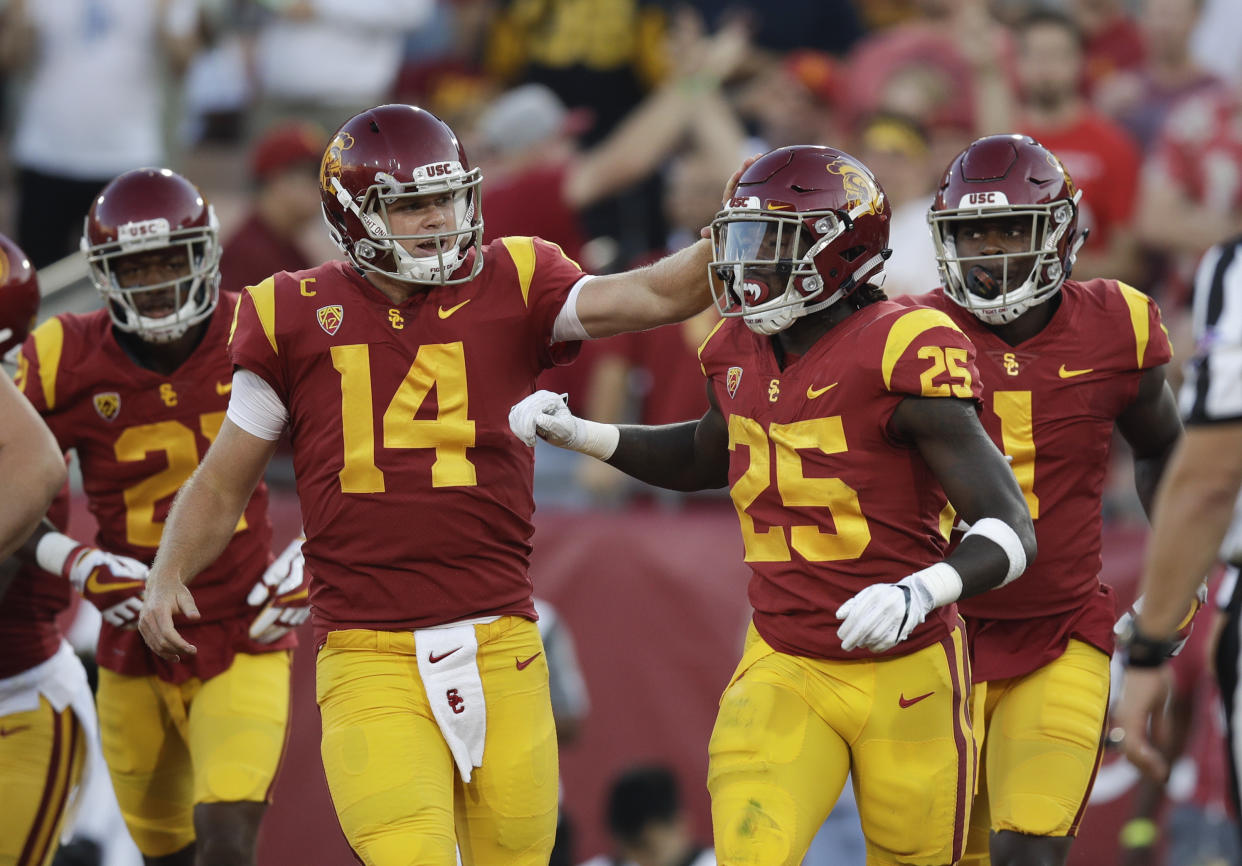Southern California running back Ronald Jones II, right, is congratulated by quarterback Sam Darnold after scoring a touchdown during the first half of an NCAA college football game against Stanford, Saturday, Sept. 9, 2017, in Los Angeles. (AP Photo/Jae C. Hong)