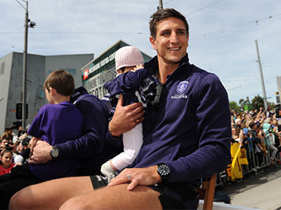 Fremantle captain Matthew Pavlich waves to the crowd during the Grand Final parade on Collins Street in Melbourne, Friday, Sept. 27, 2013. Photo: AAP