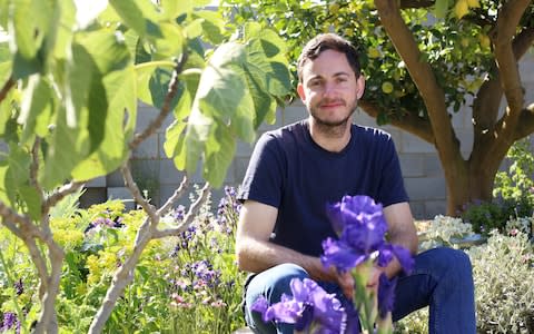 Designer Tom Massey in the Lemon Tree Trust Garden - Credit: Clara Molden