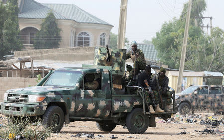 FILE PHOTO: Nigerian military secure an area where a man was killed by suspected militants near Maiduguri, Nigeria, February 16, 2019. REUTERS/Afolabi Sotunde/File Photo