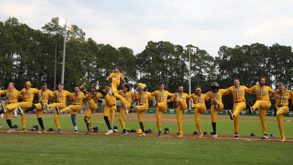 The Savannah Bananas form a kick line before the start of their game against the Aussie Drop Bears earlier this month. The Bananas have sold out their two games in Des Moines in August.