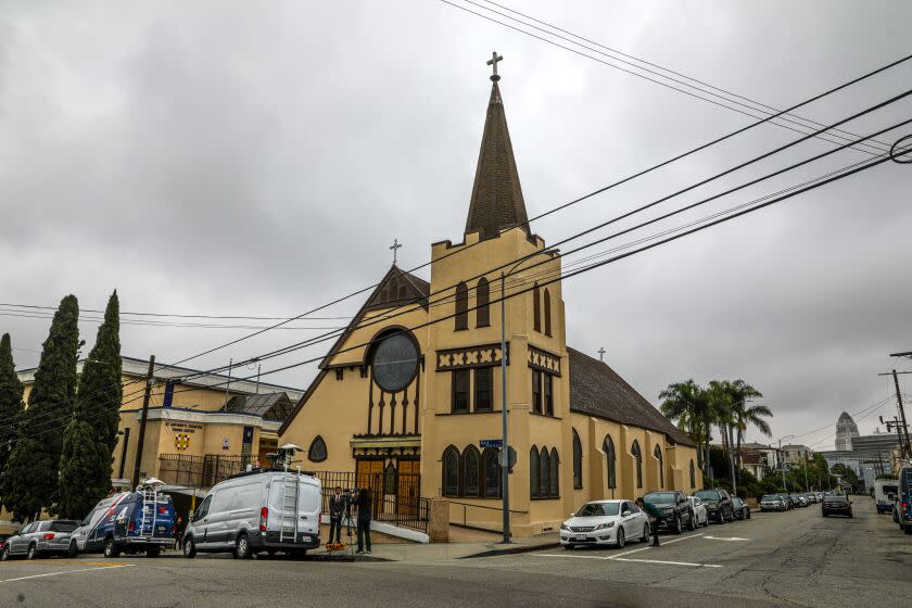 LOS ANGELES, CA - JUNE 15: A group of immigrants bused hundreds of miles from the Texas border area unexpectedly arrived at Los Angeles downtown's Union Station, and nonprofit groups today are offering to assist those migrants. The migrants were taken to St. Anthony's Croatian Catholic Church, Los Angeles, CA. (Irfan Khan / Los Angeles Times)