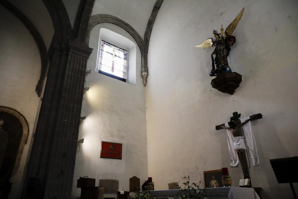 A plaque bears the name of conqueror Hernan Cortes inside the Jesus de Nazareno Church in Mexico City, Tuesday, May 18, 2021. The capital of the Aztec empire, now known as Mexico City, fell after a prolonged siege 500 years ago, marking one of the few times an organized Indigenous army under local command fought European colonizers to a standstill for months, and the final defeat helped set the template for much of the conquest and colonization that came afterward. (AP Photo/Eduardo Verdugo)