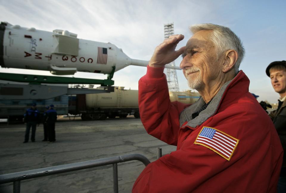 FILE-In this Friday, Oct. 10, 2008 file photo, U.S. astronaut Owen Garriott looks a space ship that will carry new crew members, including his son U.S. space tourist Richard Garriott, to the international space station at the launch pad in Russian leased Baikonur Cosmodrome, Kazakhstan. Garriott has died at his home in Huntsville, Ala. A statement released by the space agency says Garriott died Monday, April 15, 2019. He was 88 (AP Photo/Dmitry Lovetsky, File)