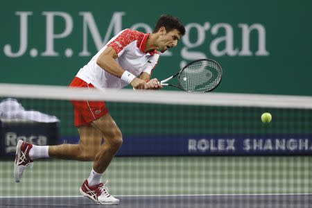 Tennis - Shanghai Masters - Men's Singles - Final - Qi Zhong Tennis Center, Shanghai, China - October 14, 2018. Novak Djokovic of Serbia in action against Borna Coric of Croatia. REUTERS/Aly Song