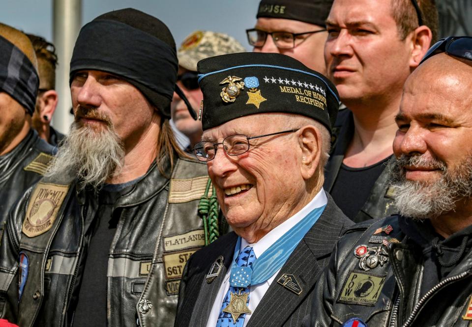 Hershel "Woody" Williams, center, poses with fellow Marines at the Charles E. Shelton Freedom Memorial at Smothers Park in Owensboro, Ky., in 2019. Williams, the last remaining Medal of Honor recipient from World War II, died June 29, 2022 He was 98.