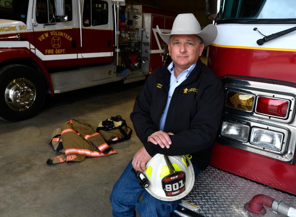 Taylor County Sheriff Ricky Bishop, who is also the chief of the View Volunteer Fire Department, sits on one of their newest engines in their also-new firehouse barn Thursday Dec. 29, 2022.