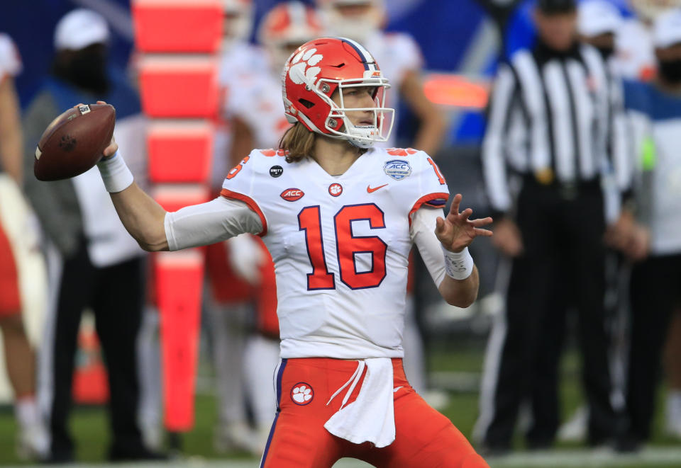 FILE - In this Saturday, Dec. 19, 2020, file photo, Clemson quarterback Trevor Lawrence (16) looks for a receiver during the first half of the Atlantic Coast Conference championship NCAA college football game against Notre Dame in Charlotte, N.C. (AP Photo/Brian Blanco, File)