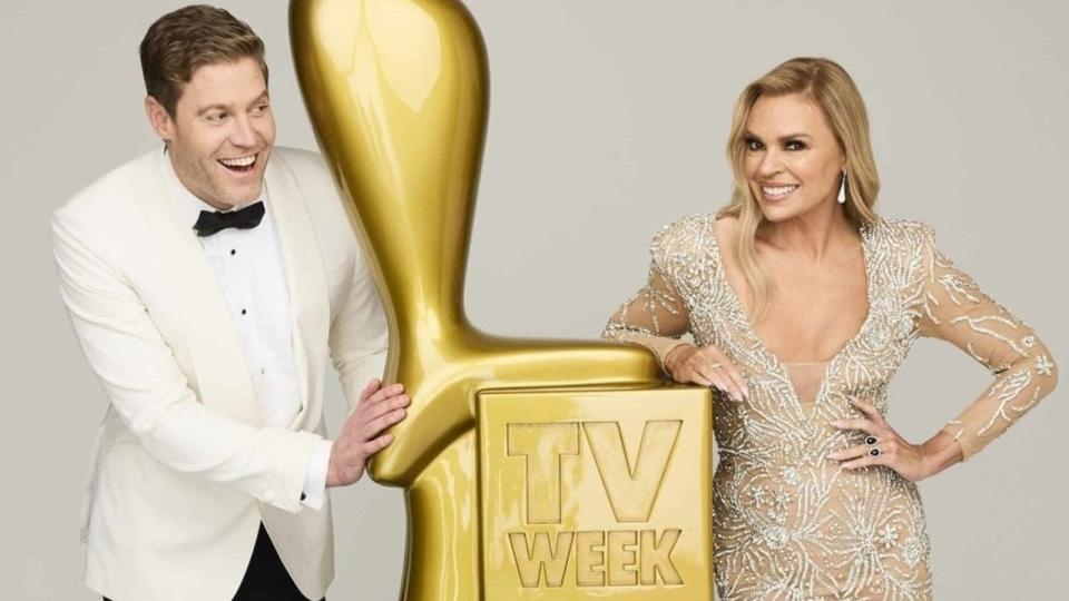 Chris Brown and Sonia Kruger posing with a Gold Logie