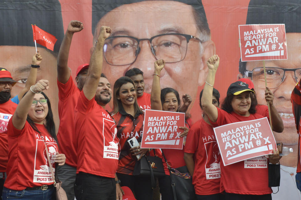 Supporters of the Pakatan Harapan (Alliance of Hope) coalition gather for Malaysian opposition leader Anwar Ibrahim near a nomination center for the upcoming general election in Tambun, Malaysia, Saturday, Nov. 5, 2022. Campaigning for Malaysia’s general elections formally started Saturday, in a highly competitive race that will see the world’s longest-serving coalition seeking to regain its dominance four years after a shocking electoral loss. (AP Photo/JohnShen Lee)