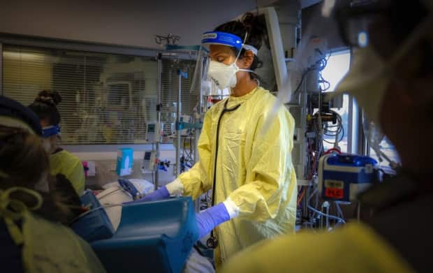 Dr. Ayesha Khory in the moments before intubating a patient with COVID-19 in an intensive care unit in Calgary, Alta.  (Leah Hennel/AHS - image credit)