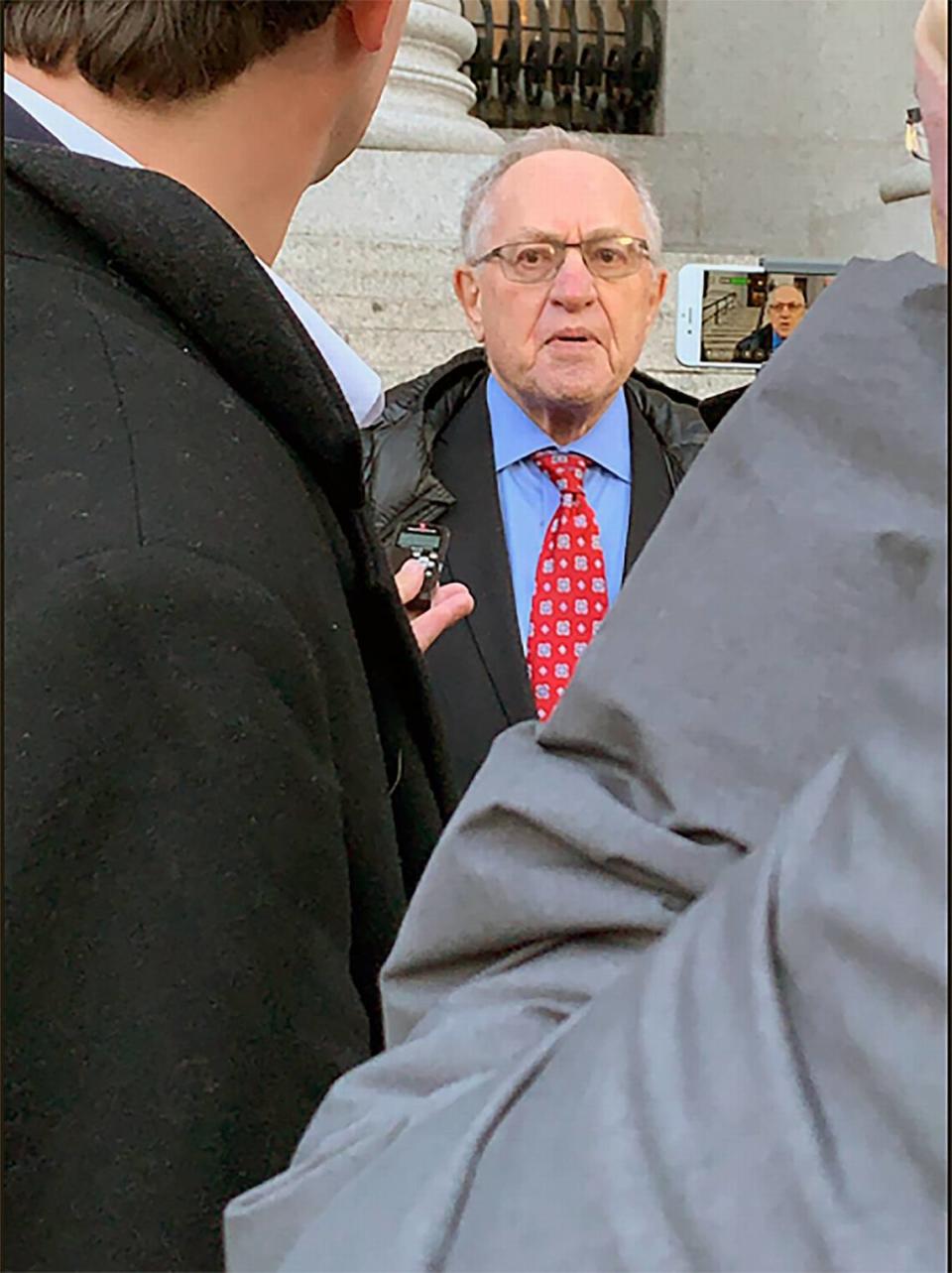 Attorney Alan Dershowitz speaks outside federal court in New York on Wednesday, March 7, 2019, after a hearing on whether to unseal documents from a civil case involving his friend and former client, Jeffrey Epstein.