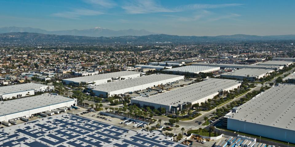 An aerial view of many warehouses gong into the distance.