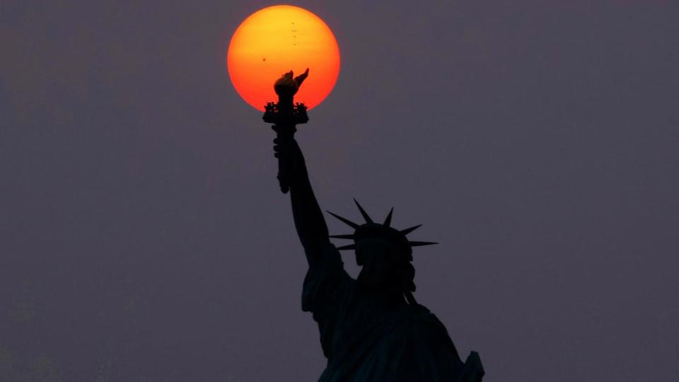<div class="inline-image__caption"><p>The sun is shrouded as it sets behind the Statue of Liberty in a hazy sky caused by smoke drifting into the Northeast of the U.S. from wildfires in Canada on May 22, 2023, in New York City.</p></div> <div class="inline-image__credit">Gary Hershorn / Getty</div>