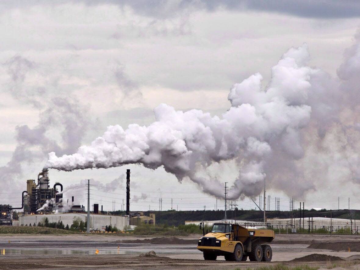 Oil and gas are major contributors to Canada's carbon emissions, from both the oilsands plants like Syncrude and out of our vehicle tailpipes. NDP MP Charlie Angus wants to crack down on fossil-fuel advertising in the same way Canada did with tobacco in the 1990s.  (Jason Franson/The Canadian Press - image credit)
