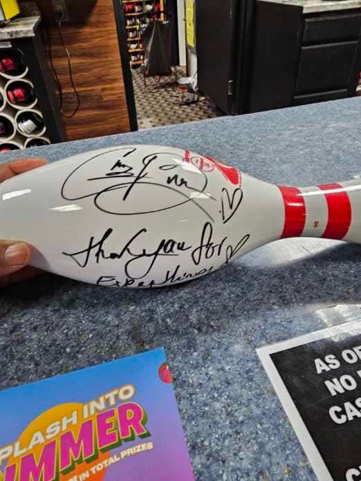 R&B star Chris Brown autographed a bowling pin at Landmark Lanes for bowling general manager Vince Pollard during Brown's surprise visit in Peoria on Saturday, June 1, 2024.