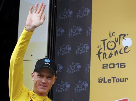 Cycling - Tour de France cycling race - The 197 km (122.4 miles) Stage 10 from Escaldes-Engordany, Andorra to Revel, France - 12/07/2016 - Yellow jersey leader Team Sky rider Chris Froome of Britain reacts on the podium. REUTERS/Juan Medina