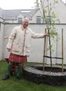 <p>Prince Charles takes a tour of the newly restored House of the Northern Gate and its gardens during a visit to Thurso, Scotland, on July 29.</p>