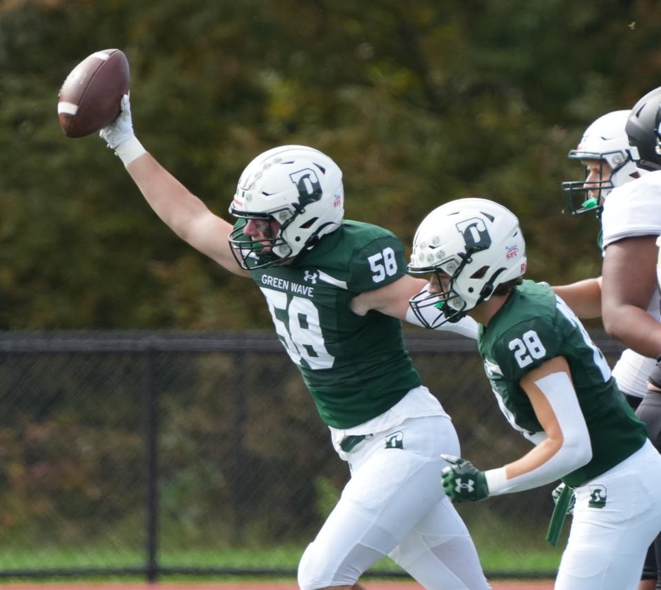 Morristown, NJ September 30, 2023 — Dillon Paul of Debarton recovers a fumble in the second half as Delbarton defeated Paramus Catholic 45-0 in an SFC United White Division contest played at Delbarton on September 30, 2023.