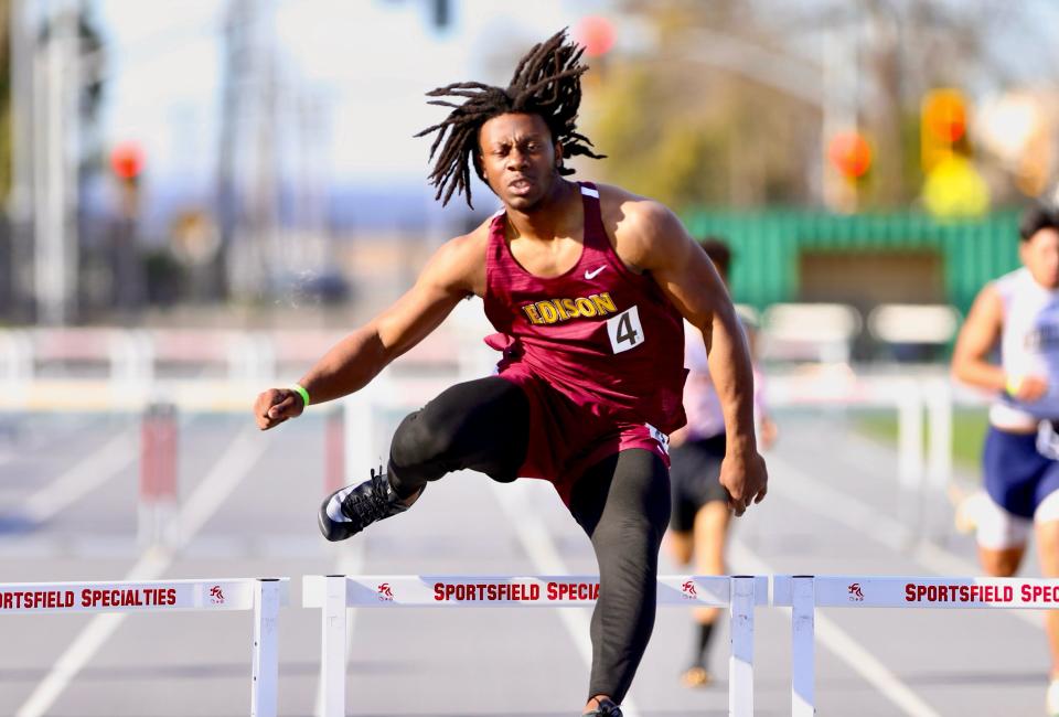 Edison's Ezekiel Conley jumps over a hurdle during one of the Vikings track meets during the 2023-24 season.