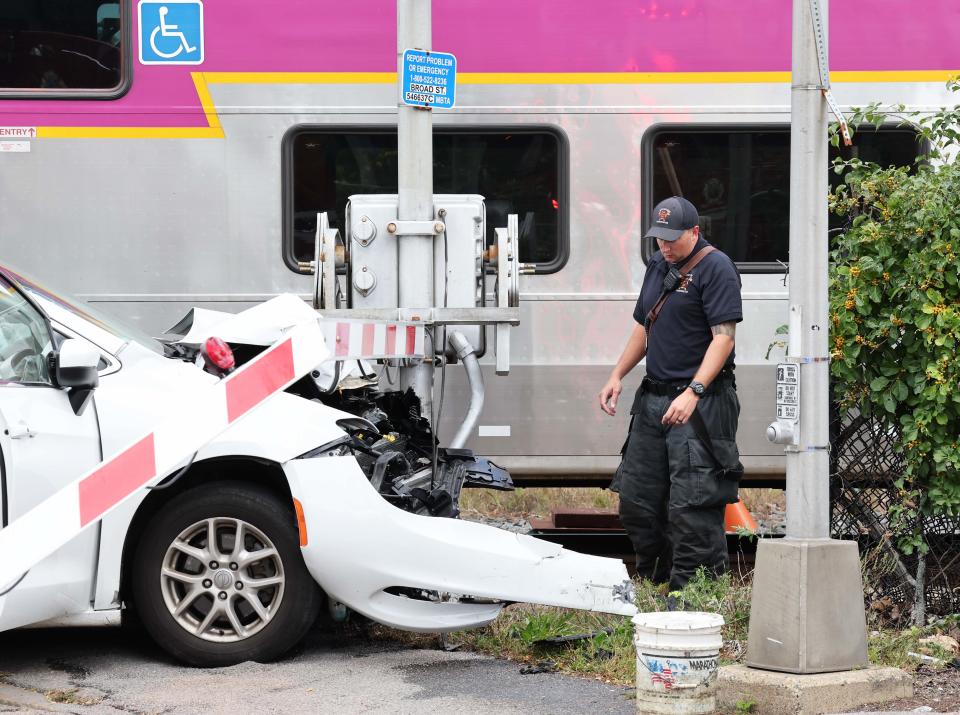 A minivan stalled at the crossing on Broad Street in Bridgewater was struck by an MBTA commuter rail train on Thursday, Sept. 29, 2022.