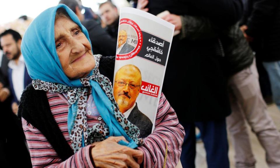 A woman holding a picture of Jamal Khashoggi at the courtyard of Fatih mosque in Istanbul