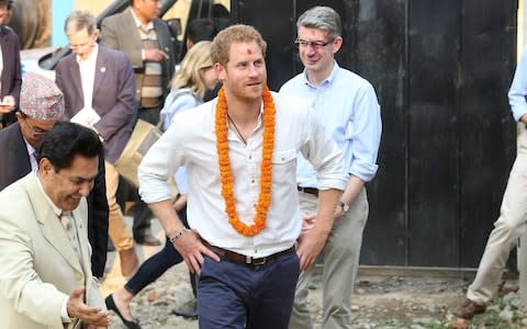 Prince Harry being accompanied by Richard Morris during a visit to Nepal in 2016 - Credit: Danny Martindale