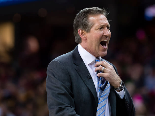 Jeff Hornacek tugs at the tie. (Getty Images)