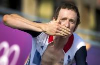 Britain's Bradley Wiggins approaches the finish line to win the gold medal after competing in the London 2012 Olympic Games men's individual time trial road cycling event in London