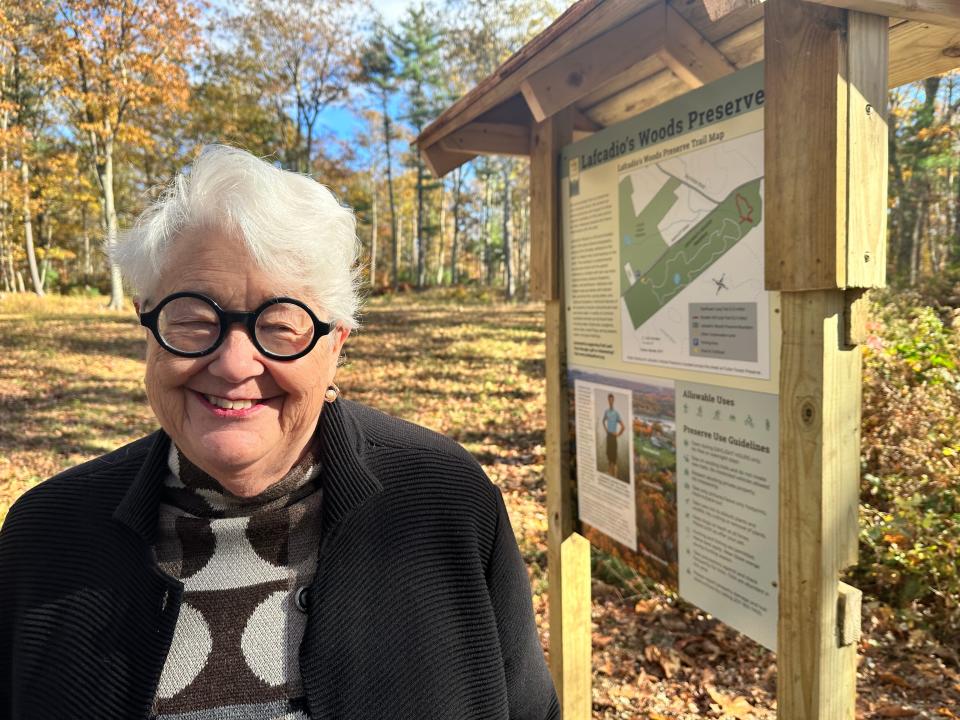 The Fuller family has donated 35 acres to the York Land Trust in honor of the late Lafcadio Cortesi, an accomplished conservationist. His aunt Martha Fuller Clark, a retired state senator from Portsmouth, stands by a sign marking the land and commemorating Cortesi.