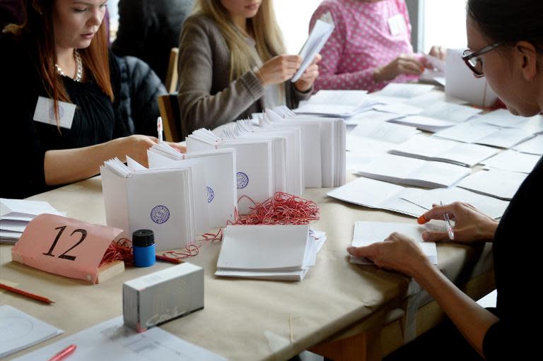 Advance votes of the Finnish parliamentary elections are counted in Helsinki on April 19, 2015
