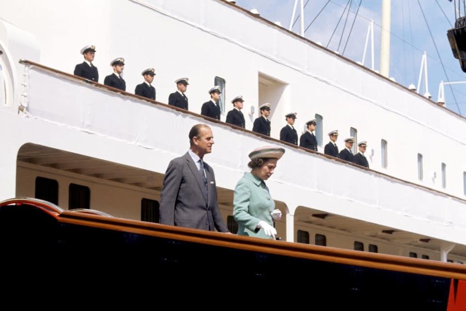 The QueenI and the Duke of Edinburgh disembarking from the Royal Yacht Britannia in Portsmouth Dockyard (Ron Bell/PA) (PA Archive)