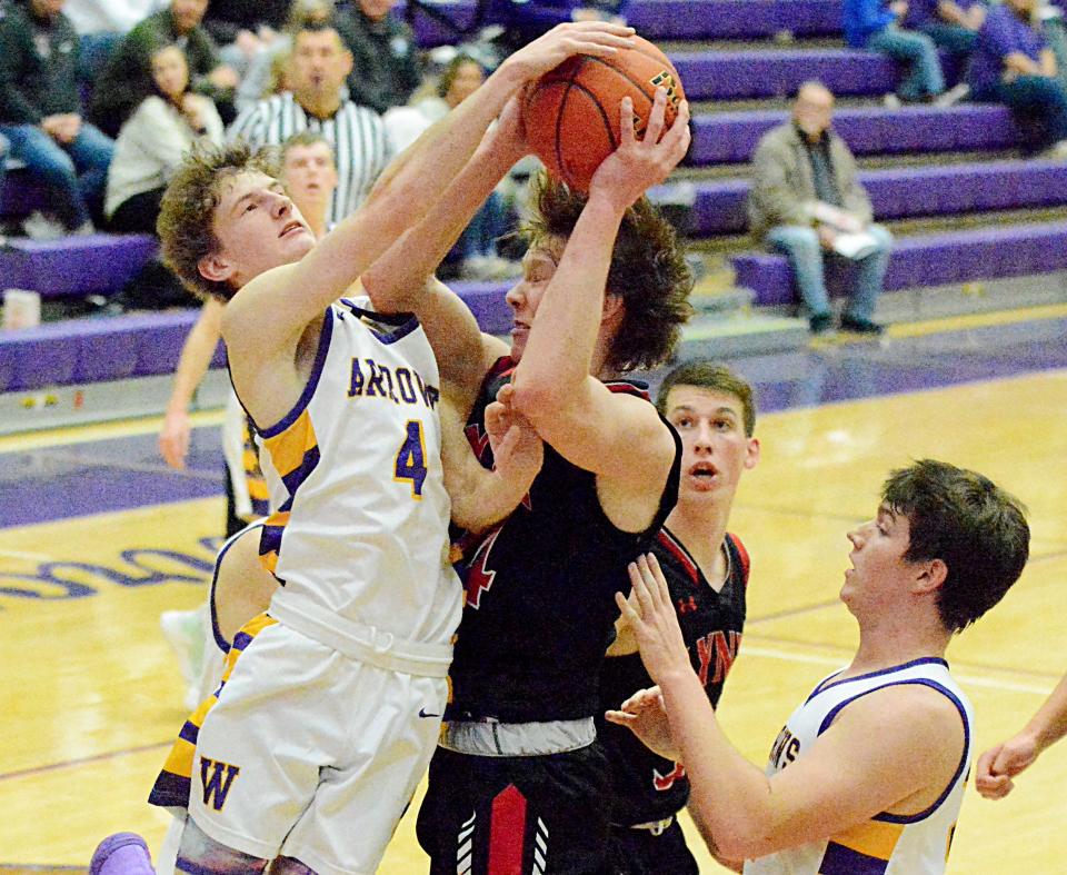 Watertown's Dylon Rawdon (4) fights for a rebound with Brandon Valley's Lukas Morgan during their Eastern South Dakota Conference boys basketball game Saturday in the Civic Arena. Brandon Valley won 62-50.