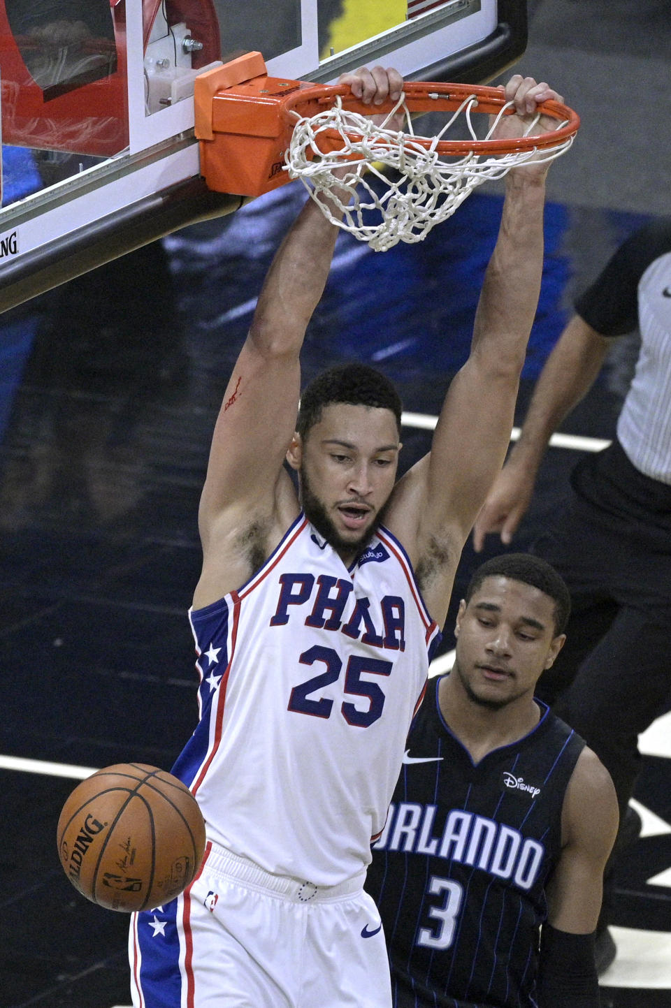 Philadelphia 76ers forward Ben Simmons (25) dunks in front of Orlando Magic forward Chuma Okeke (3) during the second half of an NBA basketball game Thursday, Dec. 31, 2020, in Orlando, Fla. (AP Photo/Phelan M. Ebenhack)