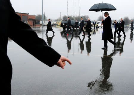 U.S. President Donald Trump, en route to deliver remarks at the American Farm Bureau Federation convention, arrives aboard Air Force One at Nashville International Airport in Nashville, Tennessee, U.S. January 8, 2018. Reuters photographer Jonathan Ernst: "One of my favorite photographers, Sam Abell, likes to quote his father: "Bad weather makes good pictures." In addition to the weather, the controlled chaos of White House press handlers and Secret Service agents help make pictures like this possible." REUTERS/Jonathan Ernst