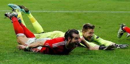 Football Soccer - Wales v Belgium - EURO 2016 - Quarter Final - Stade Pierre-Mauroy, Lille, France - 1/7/16 Wales' Gareth Bale and Wayne Hennessey celebrate at the end of the game REUTERS/Darren Staples Livepic