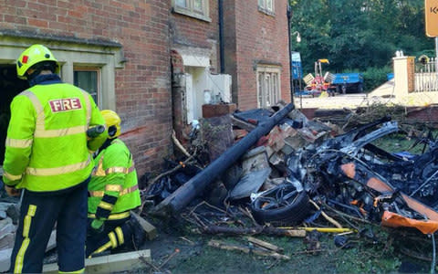 a McLaren 570S supercar crashed into a house on Yarnbrook Road, near Trowbridge, Wiltshire - Credit: Trowbridge Fire Station/PA