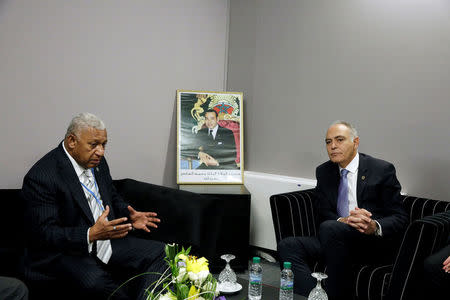 Fiji Prime Minister Frank Bainimarama (L) speaks next to Moroccan Foreign Minister and President of COP22 Salaheddine Mezouar at the UN World Climate Change Conference 2016 (COP22) in Marrakech, Morocco, November 18, 2016. REUTERS/Stringer