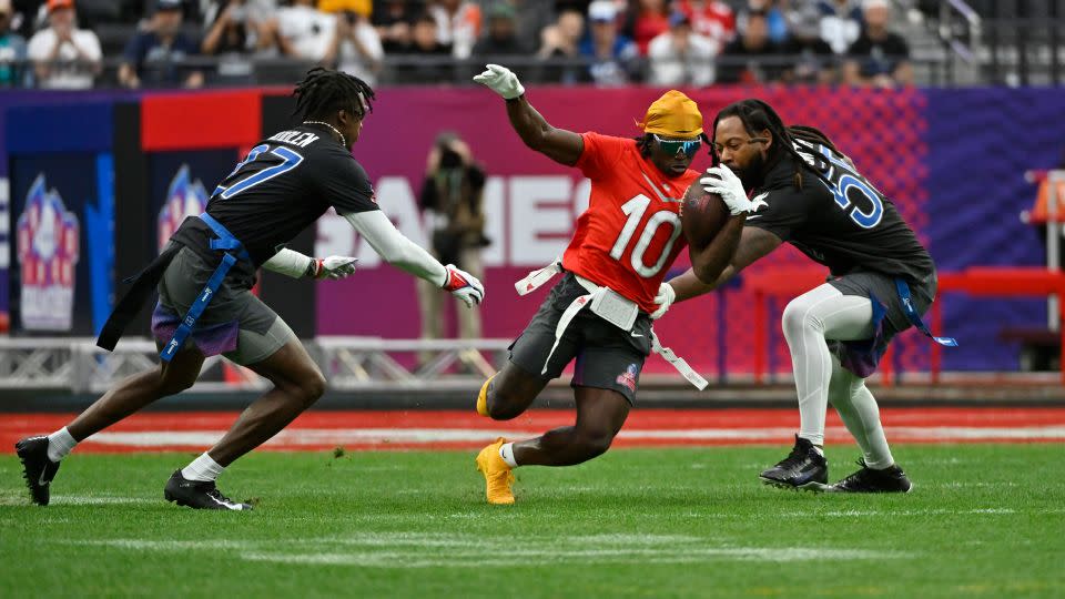 Tyreek Hill of the Miami Dolphins carries the ball during a flag football event at the NFL Pro Bowl on February 5, 2023, in Las Vegas. - David Becker/AP