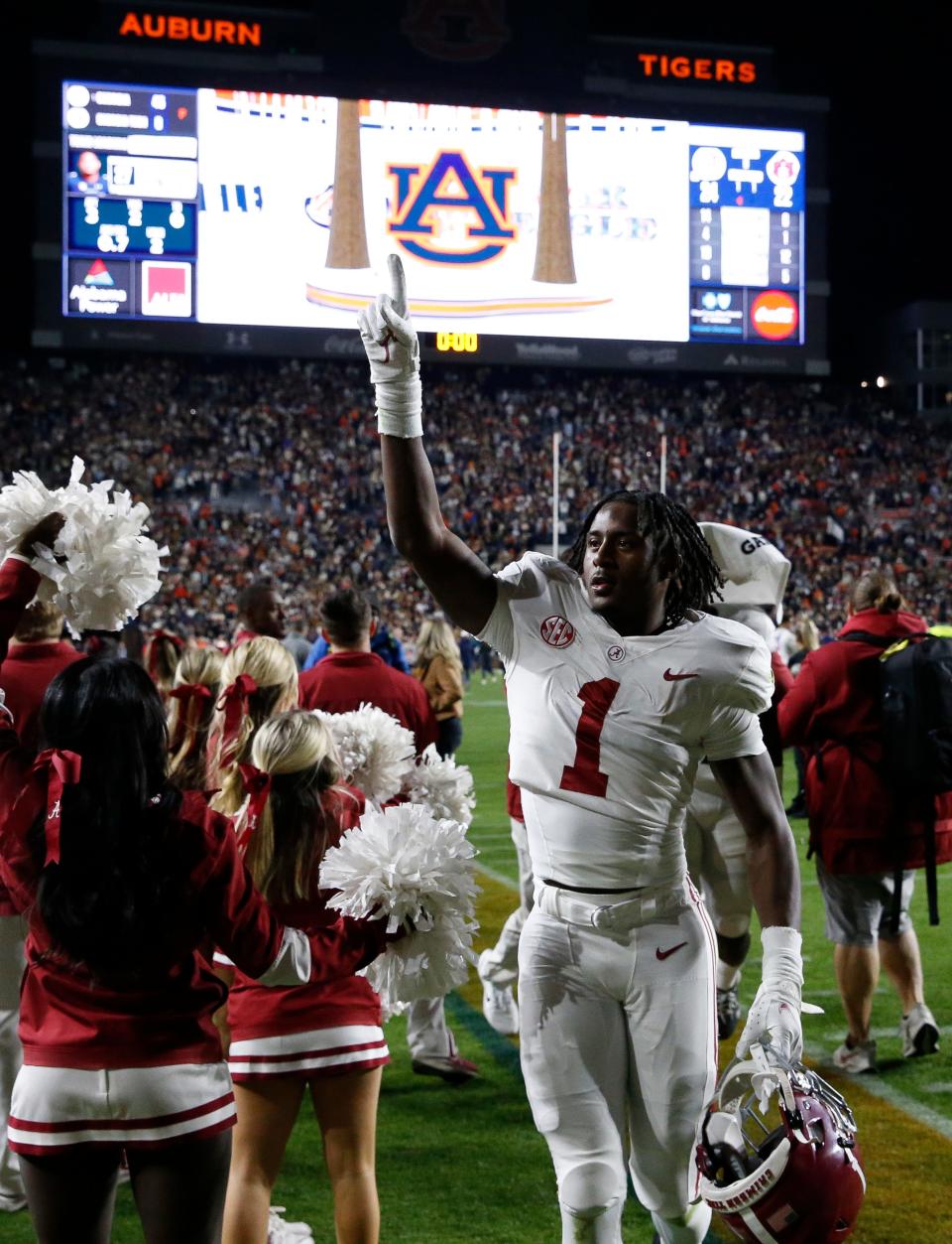 Nov 27, 2021; Auburn, Alabama, USA;  Alabama defensive back Kool-Aid McKinstry (1) celebrates as he leaves the field after the Crimson Tide's win over Auburn at Jordan-Hare Stadium. Alabama defeated Auburn 24-22 in four overtimes. Mandatory Credit: Gary Cosby Jr.-USA TODAY Sports