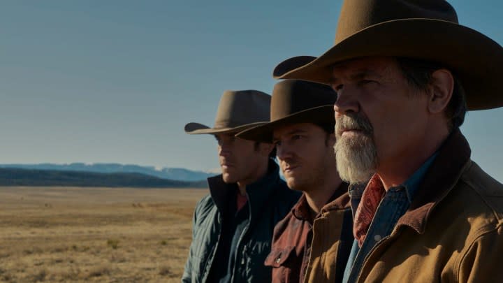 Three men standing in a row wearing cowboy hats in a scene from Outer Range on Amazon Prime Video.