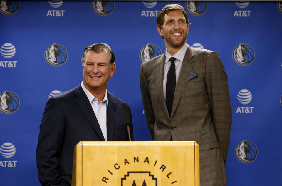 Dallas Mayor Mike Rawlings, left, and Dallas Mavericks player Dirk Nowitzki talk to the media about Nowitzki receiving the key to the city during a news conference prior to an NBA basketball game in Dallas, Wednesday, Nov. 21, 2018. (AP Photo/Michael Ainsworth)